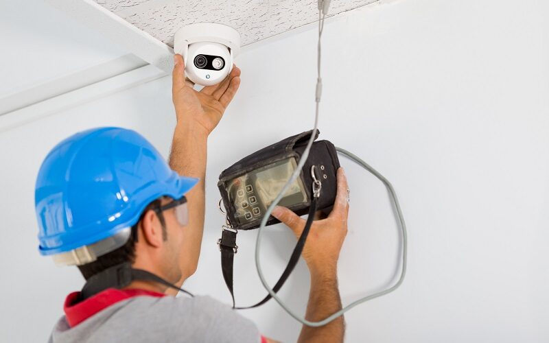 Security camera service man working.